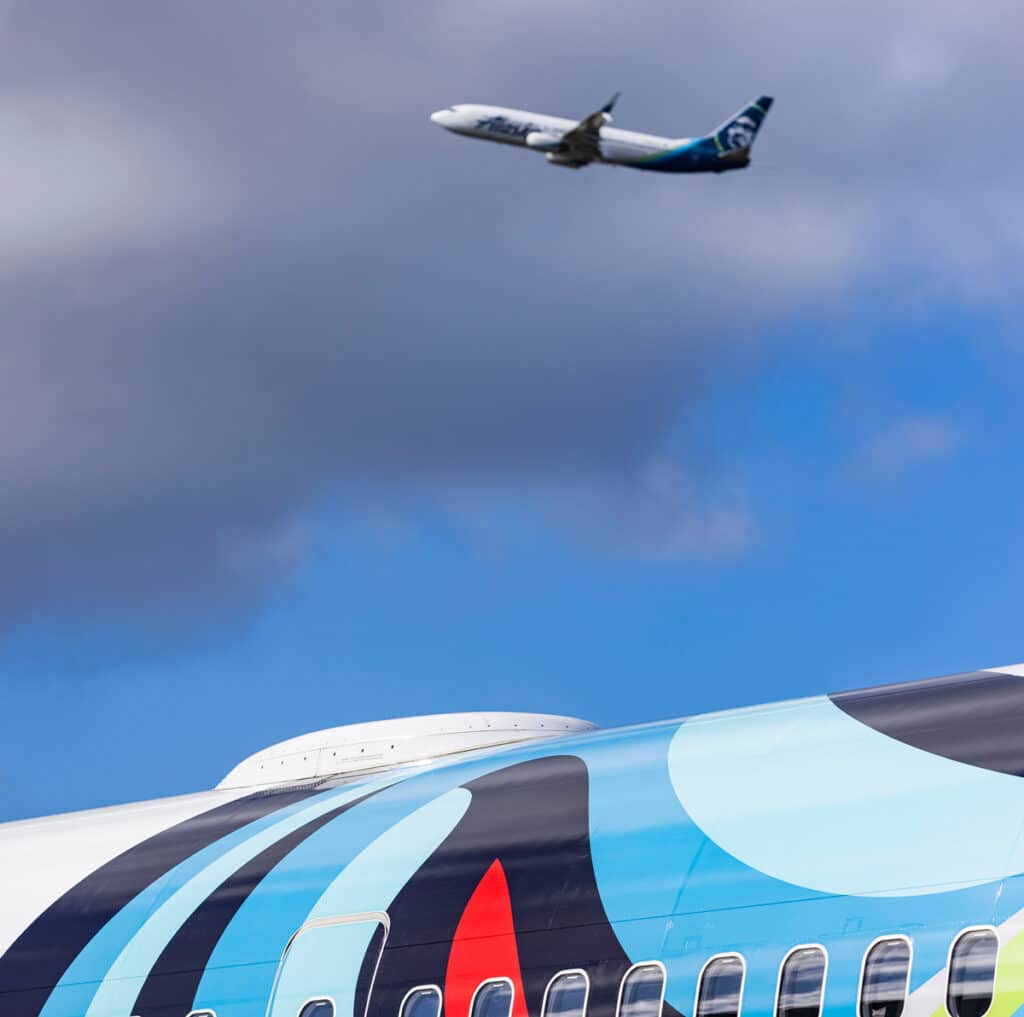 Boeing 737MAX installed with 2Ku on top, in the foreground, and another, yet to be installed, flying in the background (courtesy: Alaska Airlines).